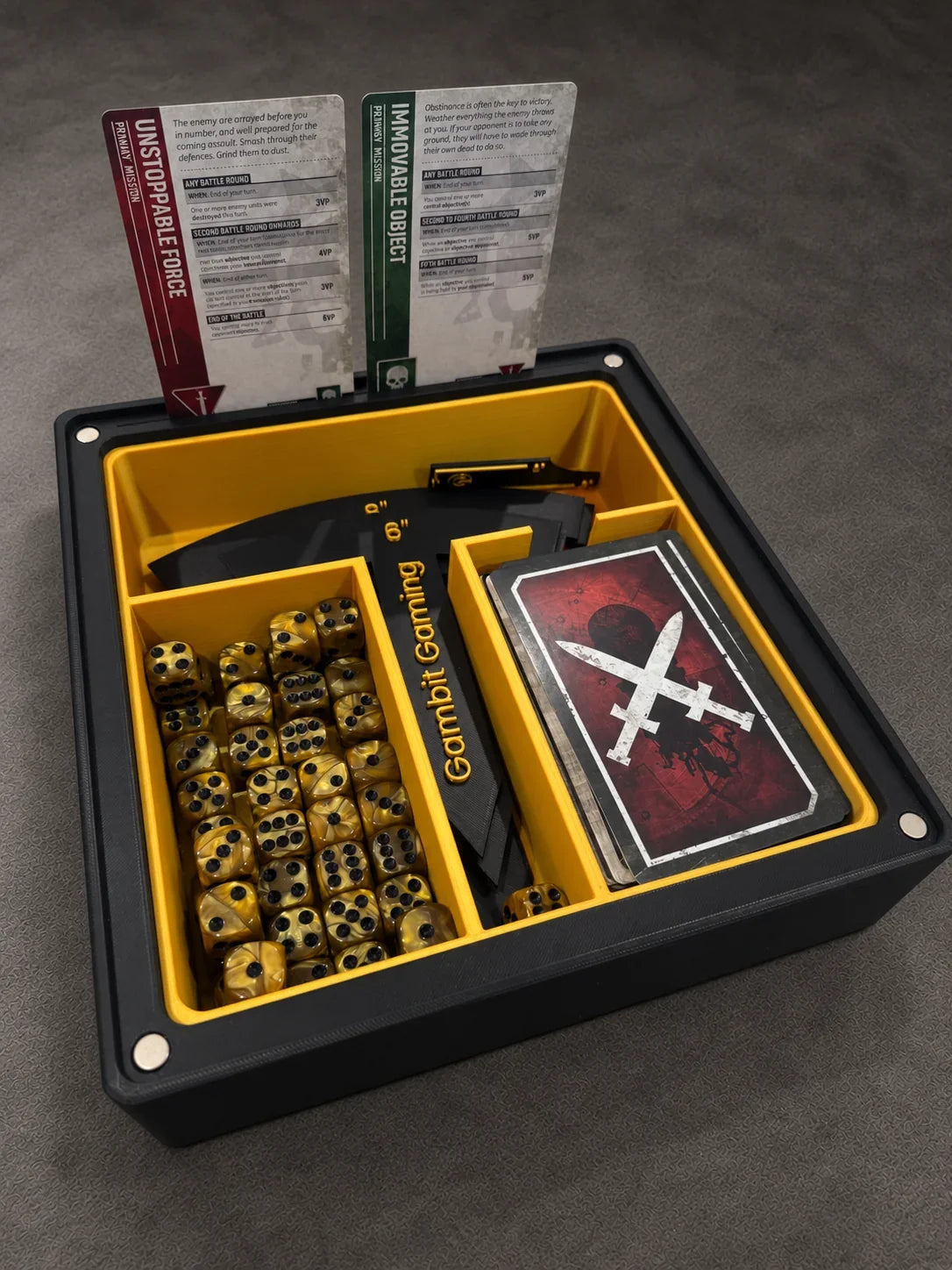 Gambit Gaming Battle Vault holding dice, mission cards and measuring tools
